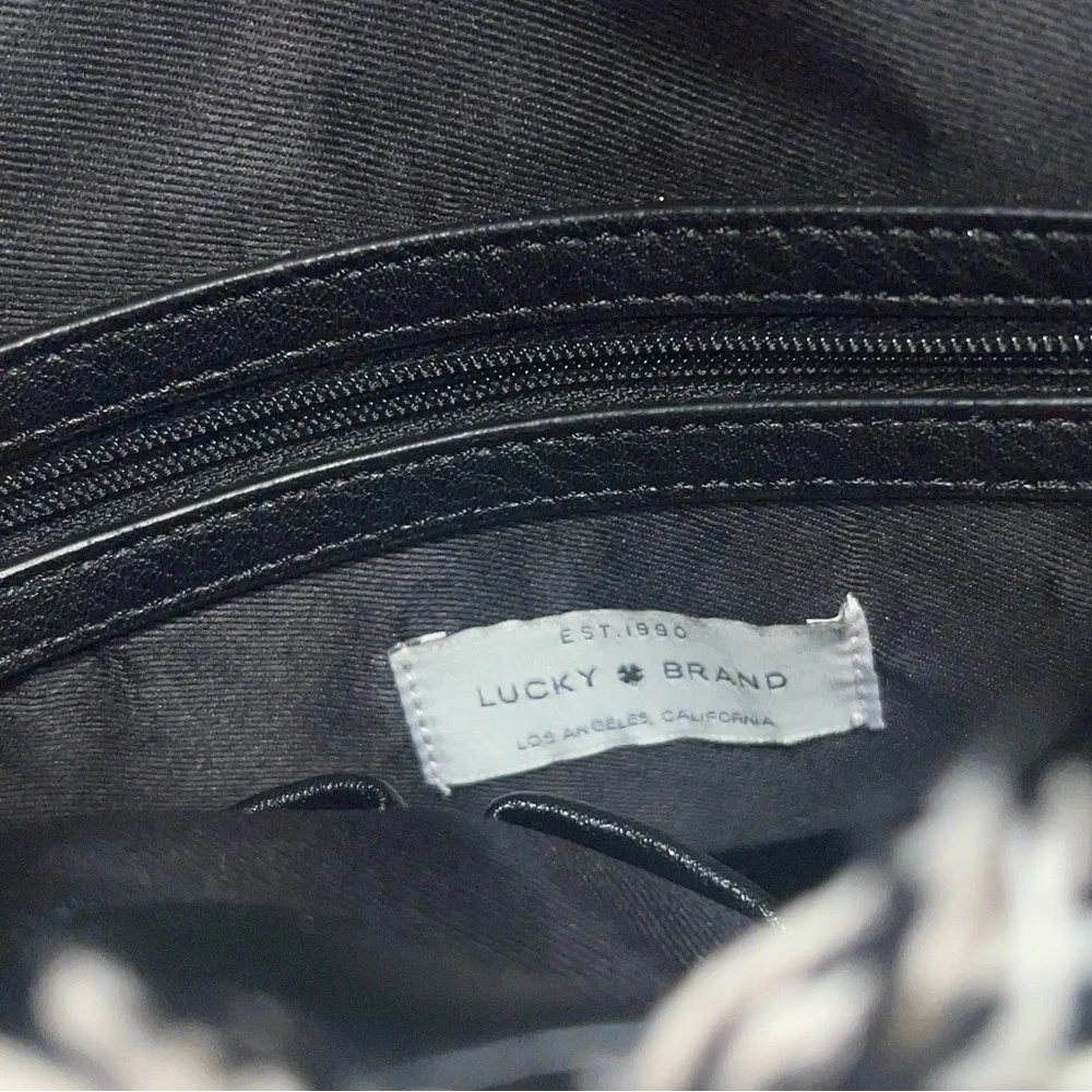 Lucky Brand Alzon Drawstring Clinched Fringed Backpack Blue, Black and Cream